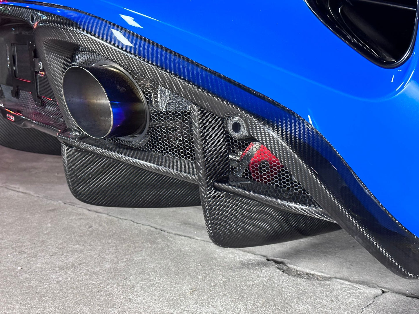 Emira carbon fibre diffuser extension by Aerie Performance